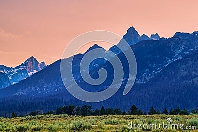 The mountains and luxuriant plants in the setting sun Stock Photo